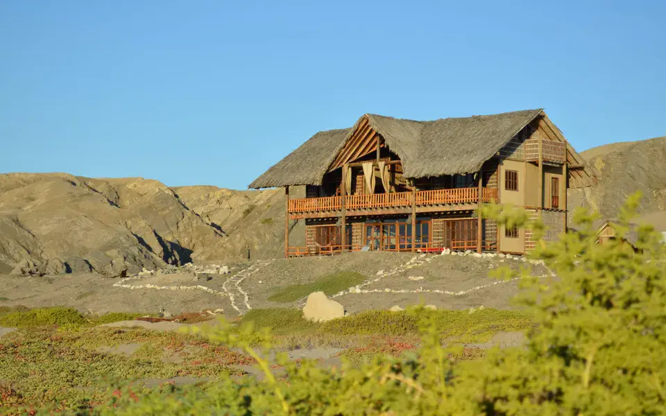 La lodge en bois sur la plage