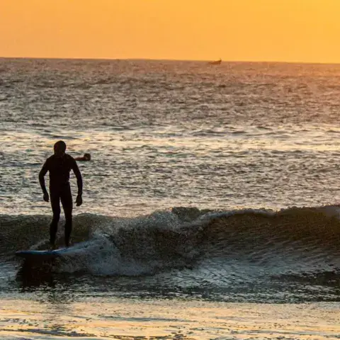 Stand up paddle au coucher du soleil