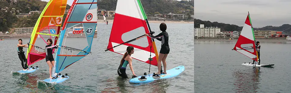 Élèves en cours de windsurf dans la baie